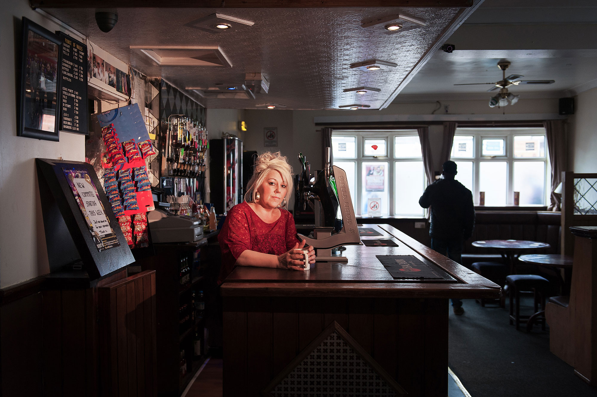 Documentary photographer Walsall - barwoman at the Desi Pubs project, West Midlands