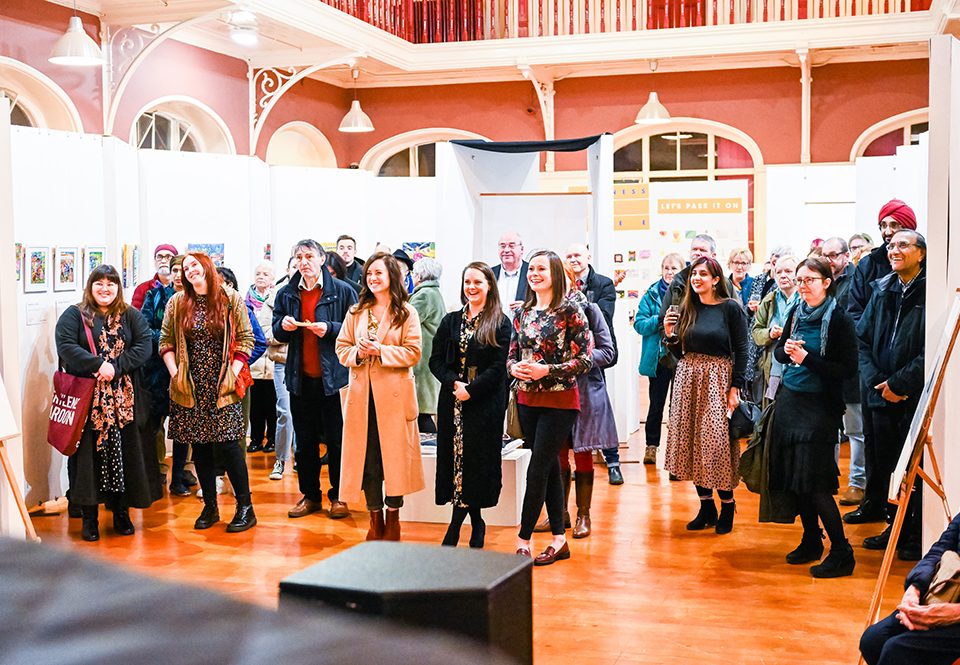 documentary photographer Birmingham — arts exhibition opening with diverse community audience